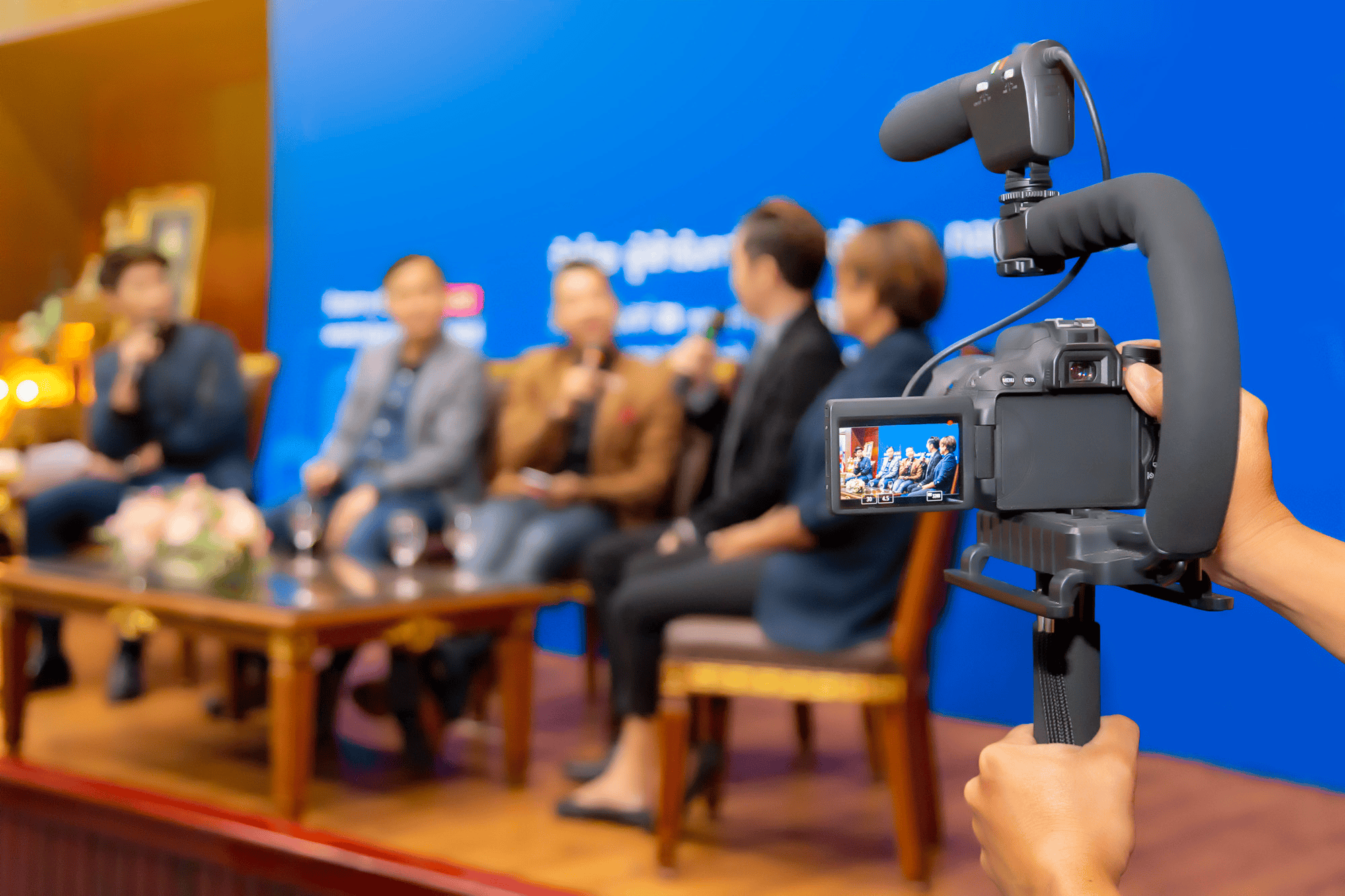 Professional corporate event videographer filming a business conference in Phoenix, Arizona with multi-camera setup