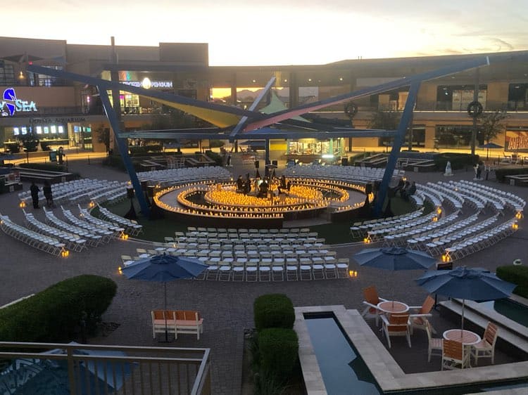 Circular round stage configured for a candlelight concert produced by Centric Events