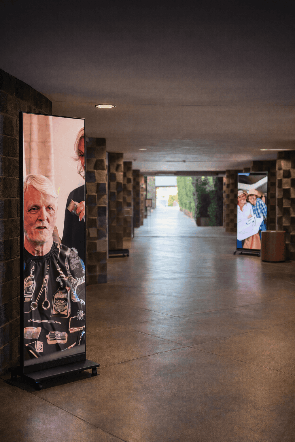 Portable LED poster display in a venue hallway showing dynamic content at an event in Phoenix