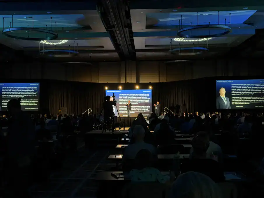 High-impact corporate event production staging at the Grand Hyatt Scottsdale Resort featuring triple LED video walls, precision lighting design, and manned broadcast camera chains for the DPA Summit.