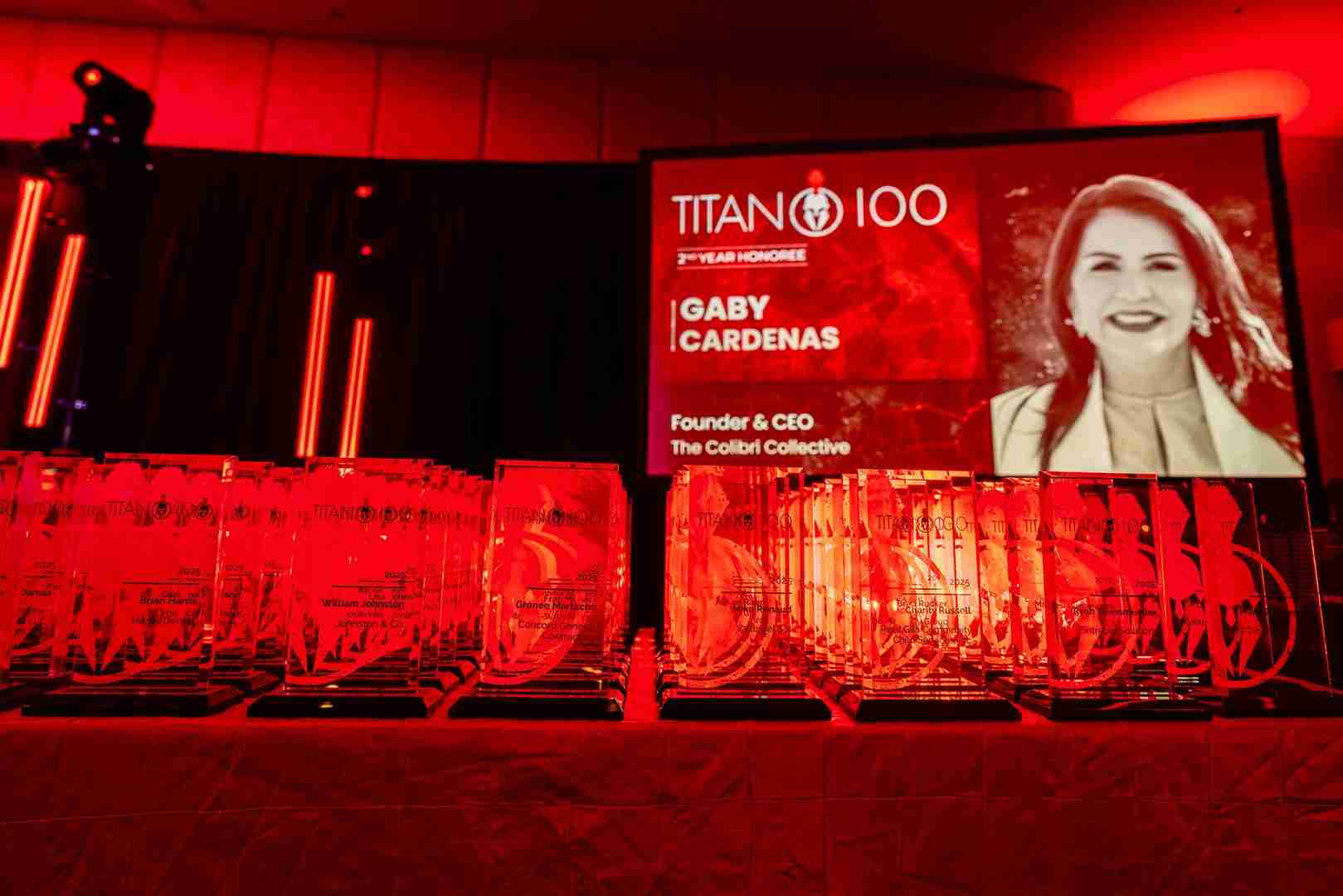 Creatively lit Titan 100 awards table showcasing Centric Events' precision lighting and audio-visual equipment.